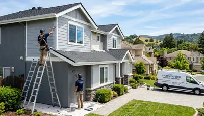 Professional house painters working on residential exterior in Modesto, CA