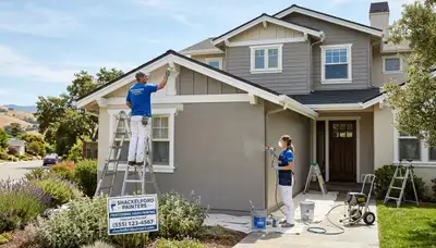 Professional house painters working on residential exterior in Modesto, CA