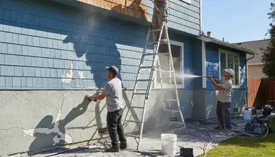 Professional painters prepping exterior surfaces for painting on a Modesto, CA home